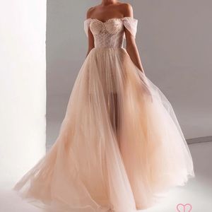 This is a Milla off-shoulder neckline gown